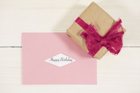 Little gift situated on Birthday cardの写真素材