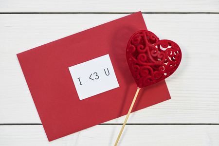 Valentines decorations on white plankの写真素材