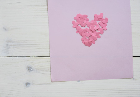 Pink hearts on lilac background