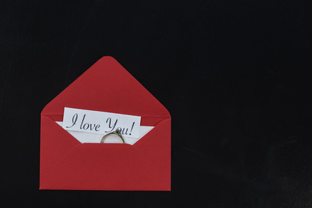 Envelope with golden engagement ring