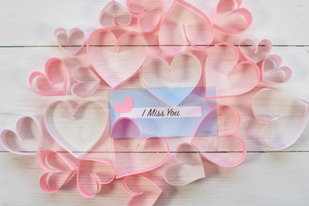 Blue paper among pink hearts