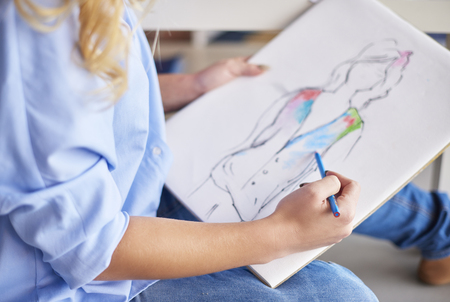 Woman is drawing more sketches の写真素材