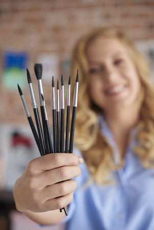 Female painter with set of paintbrushesの写真素材