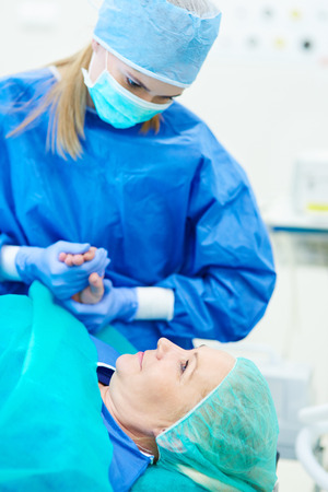 Scared woman before an operationの写真素材