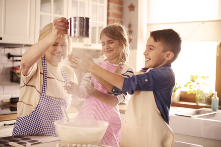 Playful kids having fun with the flour の写真素材