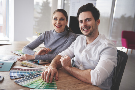 Business couple having meeting in modern officeの写真素材