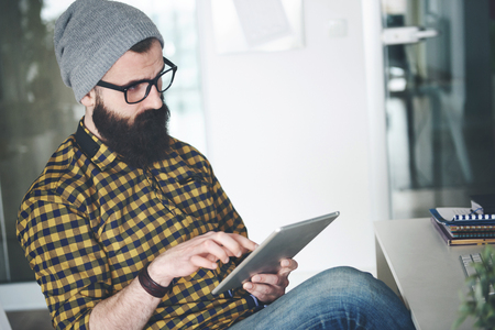Young businessman working on digital tabletの写真素材