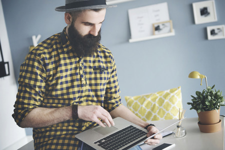Business man using laptop during jobの写真素材