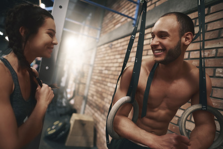 Short break during exercising on gymnastic rings