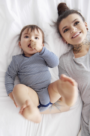 Directly above shot of cute baby and mummyの写真素材