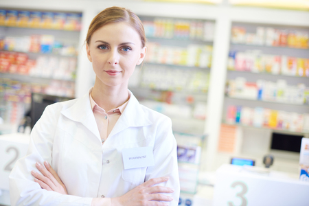 Top view of confident druggist in drugstoreの写真素材