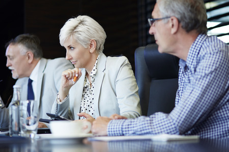 Coworkers carefully listening to presentation 