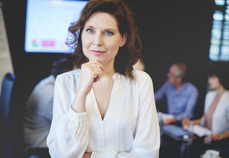 Business woman with hand on chin