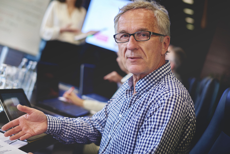 Portrait of senior businessman in conference roomの写真素材