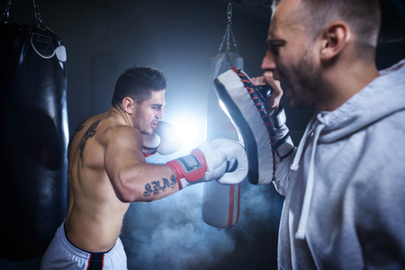 Man with coach training indoorsの写真素材