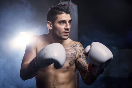 Mid adult man in boxing glovesの写真素材