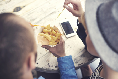 High angle view of couple having fast foodの写真素材