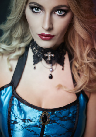 Serious woman in obscure clothingの写真素材