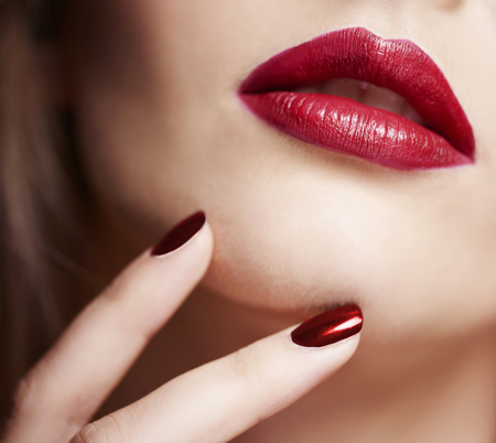 Close up on red female faceの写真素材