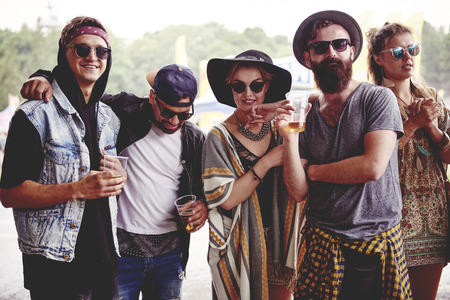 Fashionable friends at the music festivalの写真素材