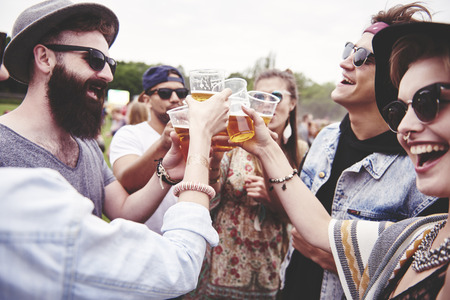 Friends start a party on fresh airの写真素材