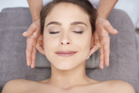 Smiling woman resting at the spa salonの写真素材