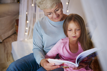 Grandmother teach granddaughter how spelling