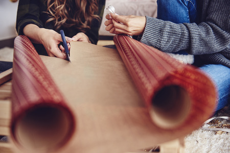 Human hand cutting christmas paperの写真素材