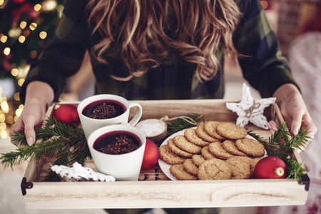 Unrecognizable woman holding tray with snackの写真素材