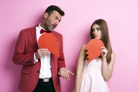 Sad man asking woman's pardon の写真素材