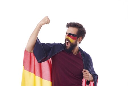 Ecstatic fan with flag of Germany cheering の写真素材