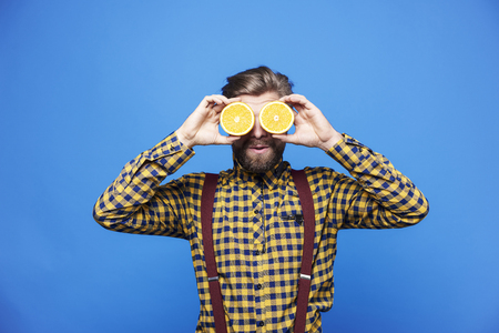 Man man with orange on eyes 
の写真素材