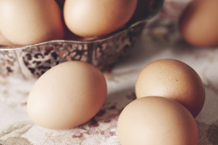 Close up of brown eggs on table 