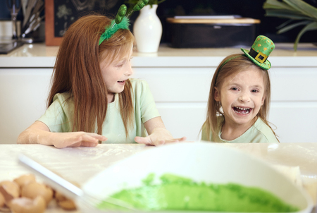 Cheerful siblings having a fun at kitchen の写真素材