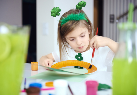 Child doing decorations at irish party
 の写真素材