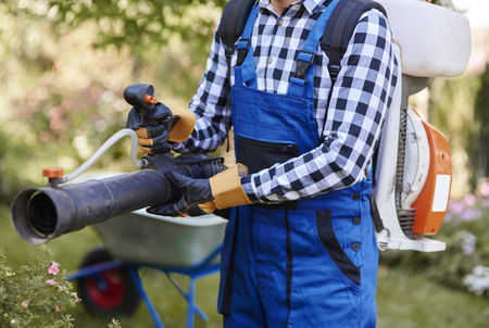 Unrecognizable man with modern gardening equipment