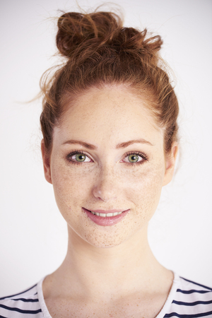 Portrait of beautiful woman smiling at studio shotの写真素材