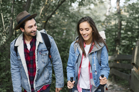 Front view of young couple hiking in the forestの写真素材
