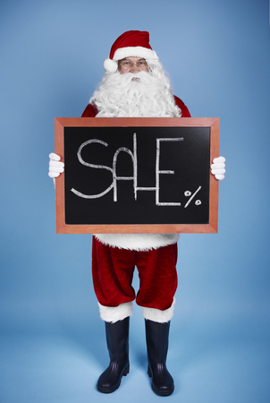 Full-length portrait of santa claus holding bannerの写真素材