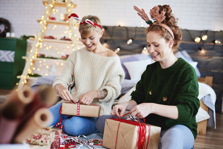 Happy girls making christmas presentsの写真素材