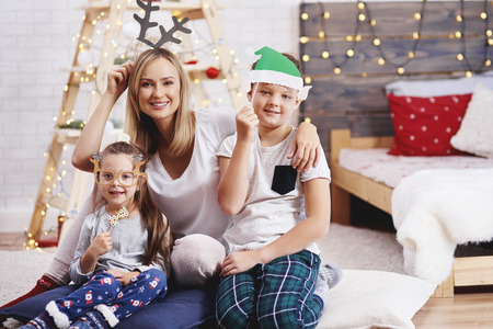 Portrait of mother and children at Christmasの写真素材