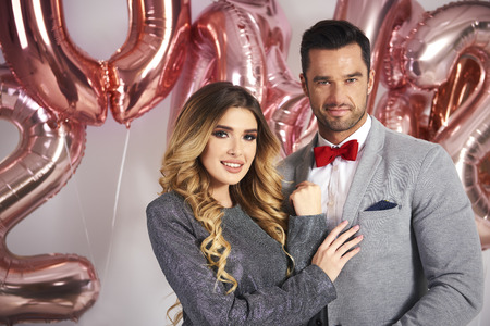 Portrait of loving couple celebrating New Year