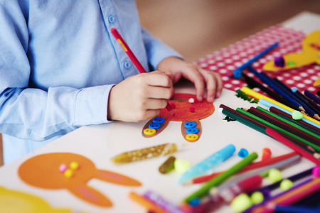 Child preparing decorations for Easterの写真素材