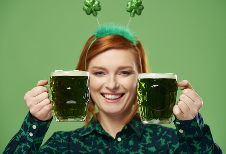 Woman making a toast to Saint Patrick's Dayの写真素材