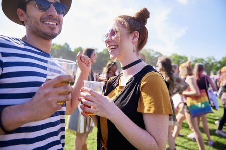 Young couple have good party at the festivalの写真素材