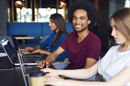 Portrait of smiling African man during business meeting