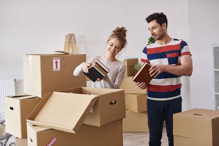 Young couple moving in to house