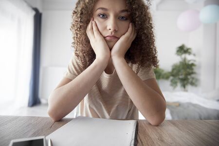 Portrait of depressed teenage girlの写真素材