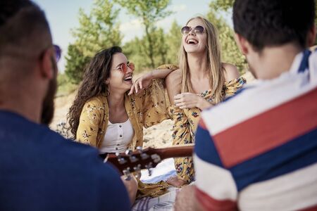 Young people having fun together on the beachの写真素材