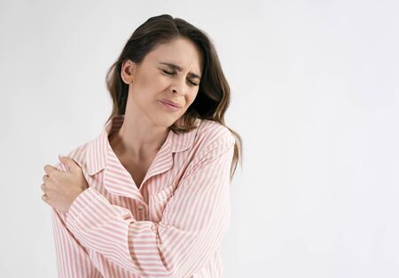 Woman suffering from shoulder painの写真素材